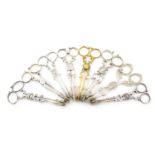 A collection of seven pairs of antique silver sugar nips, including a Victorian pair by Rawlings and