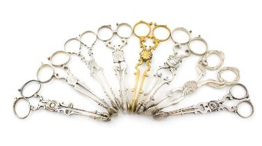 A collection of seven pairs of antique silver sugar nips, including a Victorian pair by Rawlings and