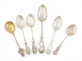 A mixed lot of silver spoons, comprising: a Victorian tablespoon with engraved ivy decoration, by