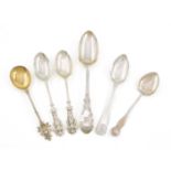 A mixed lot of silver spoons, comprising: a Victorian tablespoon with engraved ivy decoration, by