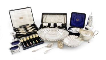 A mixed lot of silver items, comprising: an oval dish, Sheffield 1895, two scallop-shaped butter