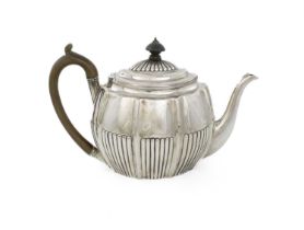 A George III silver teapot, maker's mark over-stamped, London 1801, oval lobed and fluted form,