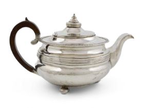 A George III silver teapot, by John Cowie, London 1814, circular form, gadroon border with reeded