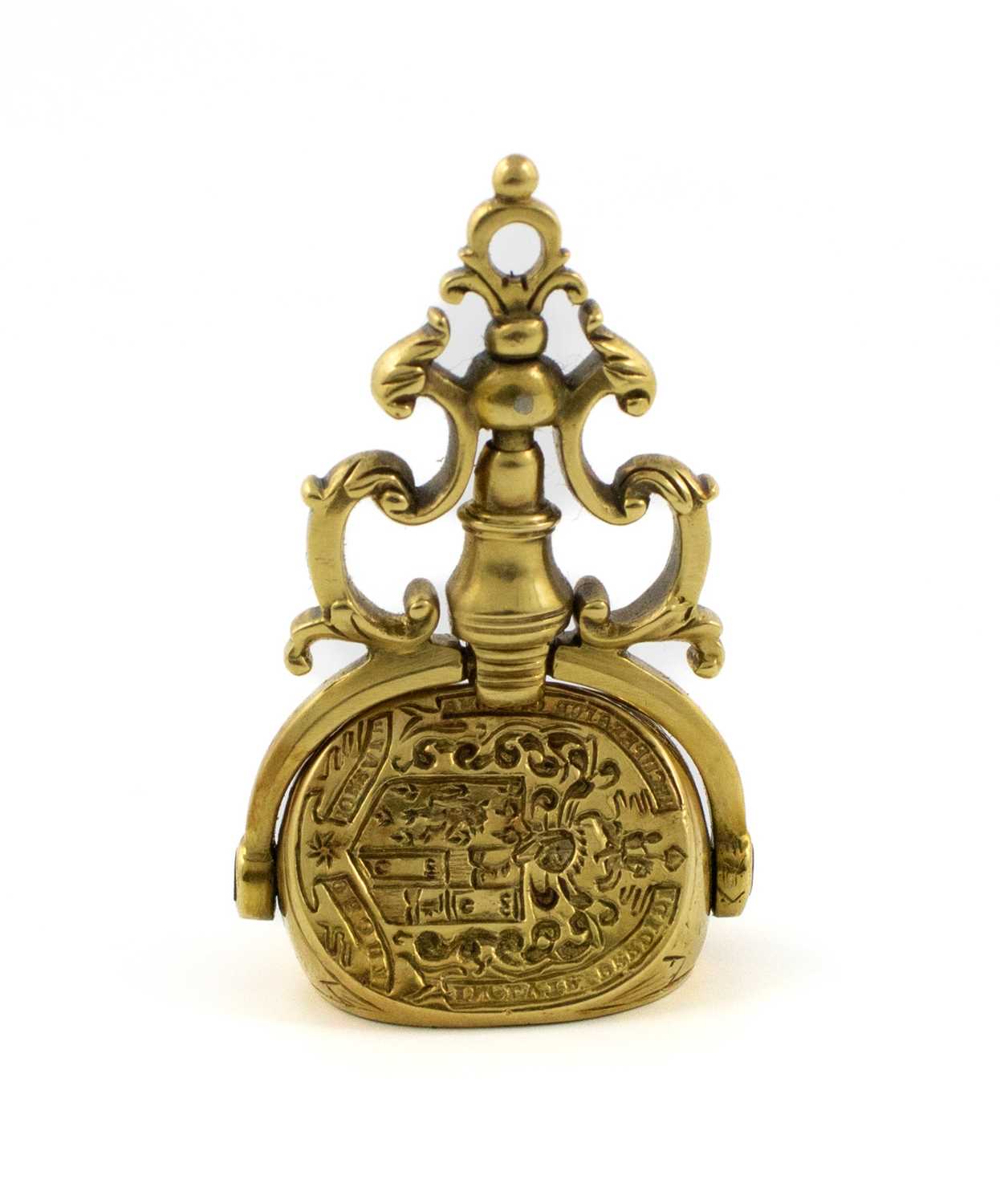 An 18th century spinning gold fob seal, unmarked, the three matrixes engraved with two armorials and