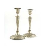A pair of Edwardian silver candlesticks, by Fordham & Faulkner, Sheffield 1906, in the classical