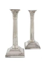 A pair of Edwardian silver candlesticks, by Goldsmiths & Silversmiths Co Ltd, London 1906, fluted
