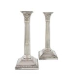 A pair of Edwardian silver candlesticks, by Goldsmiths & Silversmiths Co Ltd, London 1906, fluted