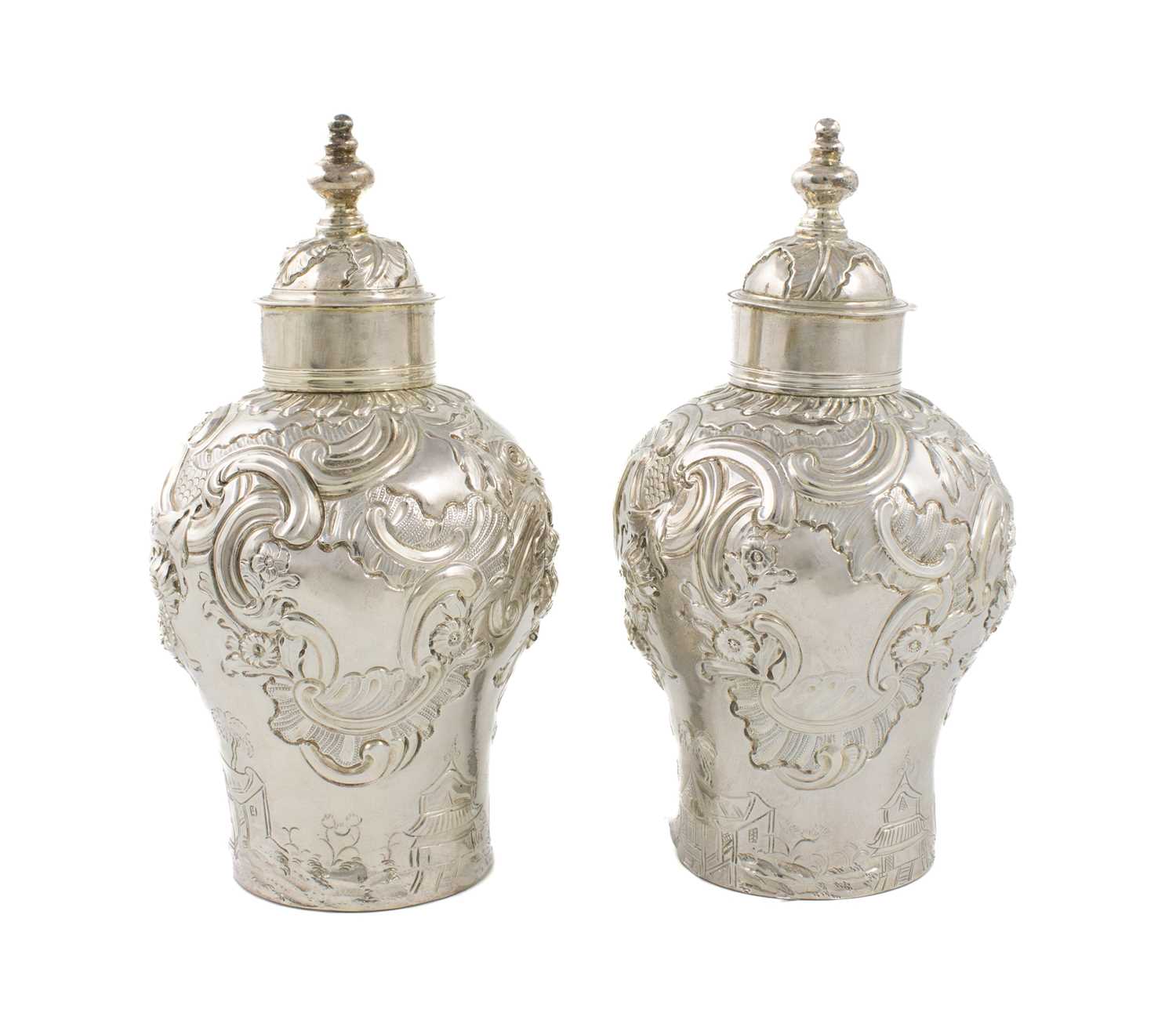 A pair of George II silver chinoiserie tea caddies, marked WM, London 1753, baluster form, decorated