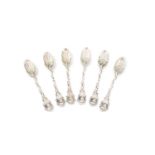 A set of six 18th century cast silver teaspoons, unmarked, circa 1750, the terminals with female