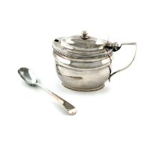 A George III silver mustard pot, by John Emes, London 1806, oval form, scroll handle, reeded border,