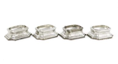 A matched set of four George II silver trencher salt cellars, by Edward Wood, London 1728 and