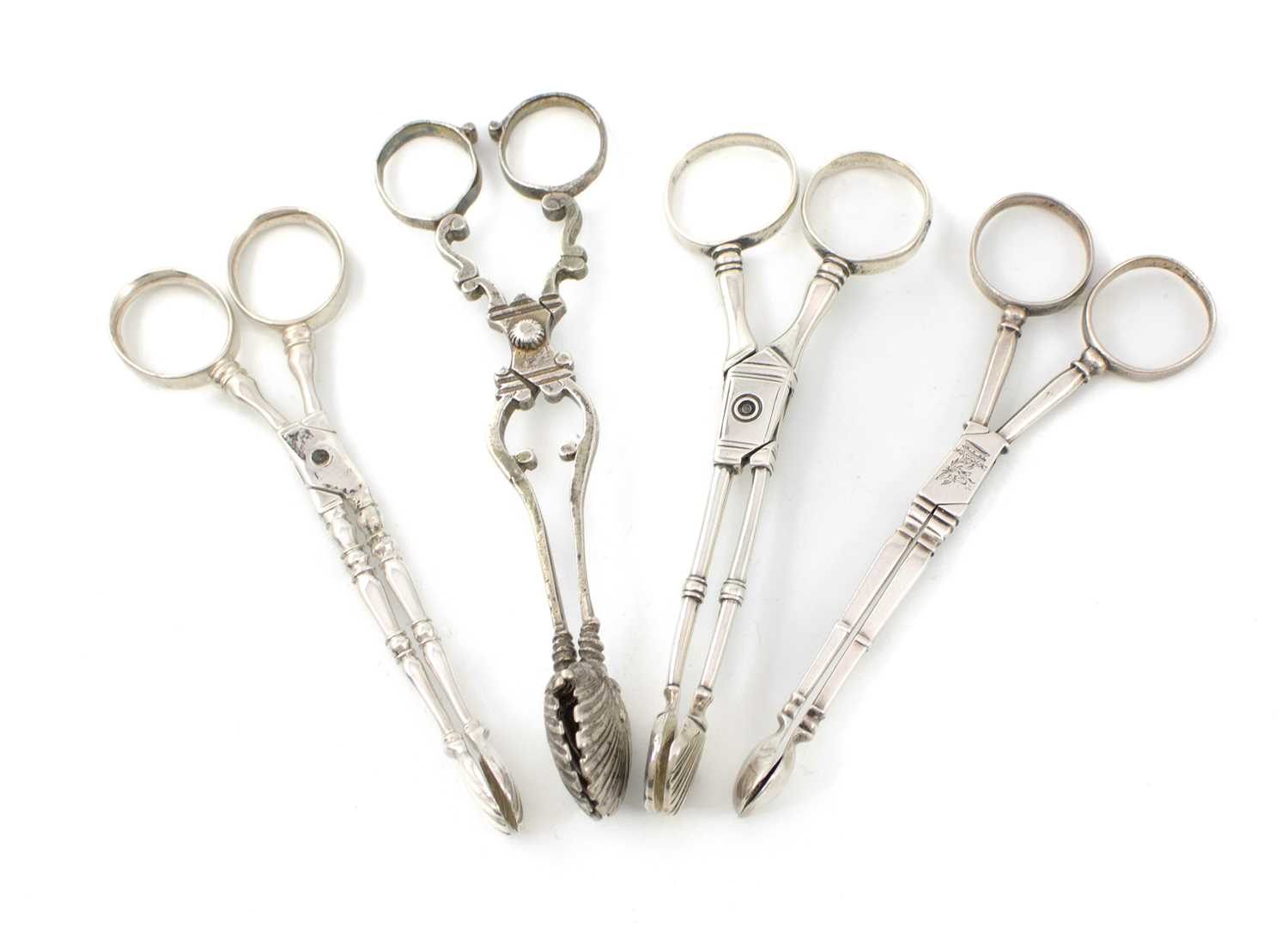 A collection of four pairs of 18th century silver sugar nips, comprising: an Irish pair, circa 1740,