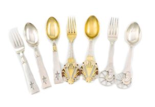 By A Michelson, a collection of Danish silver Christmas forks and spoons, comprising a silver-gilt