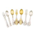 By A Michelson, a collection of Danish silver Christmas forks and spoons, comprising a silver-gilt
