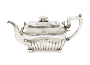 λ A George III Irish silver teapot, mark of Christopher Haines, Dublin 1809, rectangular form,