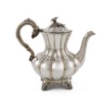 λ A Victorian silver coffee pot, by William Hunter, London 1837, lobed baluster form, a domed hinged