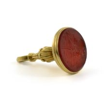 An 18th century gold-mounted cornelian fob seal, unmarked, circa 1770, oval form, fluted urn-