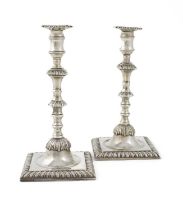 A pair of George III silver taper sticks, maker's mark of J.H, London 1763, knopped and baluster