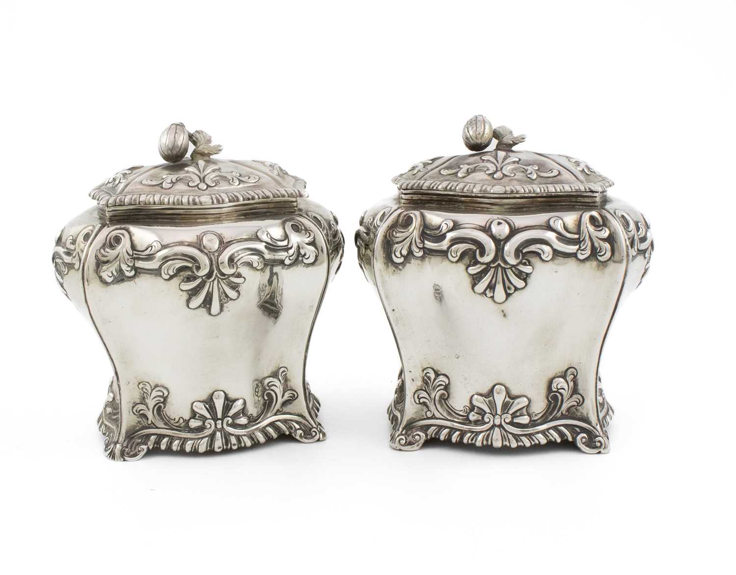 A pair of George III silver tea caddies, by Albartus Schurman, London 1763, shaped rectangular bombe