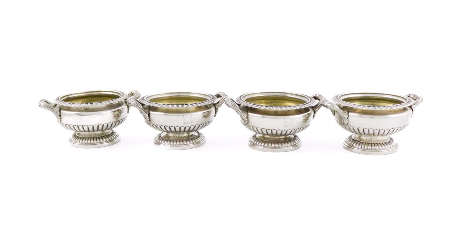 A set of four George III silver salt cellars, by Willliam Eaton, London 1828, circular urn form,