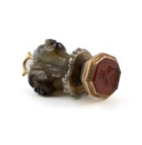 An early-19th century gold-mounted agate seal, unmarked, circa 1820, carved in the form of three