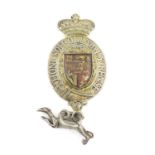 A George III silver-gilt King's messenger badge, unmarked, the greyhound with a lion passant, shaped