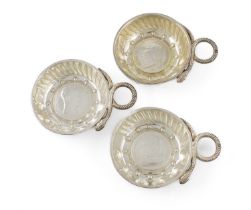 Three French silver wine tasters, circular form, punched and fluted decoration, snake ring