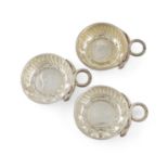 Three French silver wine tasters, circular form, punched and fluted decoration, snake ring