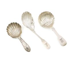 A small collection of three antique Irish silver caddy spoons, comprising: a Bright-cut Star one,