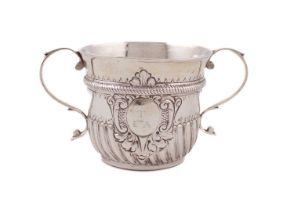 A George II silver two-handled porringer, by Richard Bayley, London 1728, circular form, part-fluted