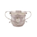 A George II silver two-handled porringer, by Richard Bayley, London 1728, circular form, part-fluted