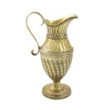 A George III silver-gilt cream jug, maker's mark worn, London 1808, baluster vase form, fluted and