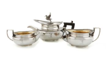 A George III silver three-piece tea service, by William Frisbee, London 1806, circular bulbous form,