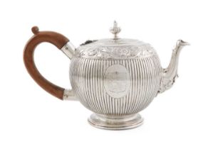 A George IV silver teapot, by Benjamin Smith, London 1822, fluted bullet form, a band of scroll