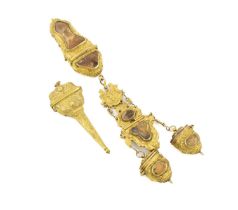 A 18th century gilt-metal and agate chatelaine, unmarked, the clip and implements with chased scroll