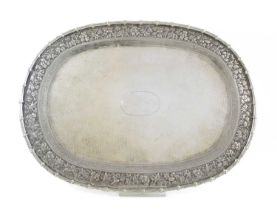 A late-19th/early-20th century Chinese silver tray, by Tu Mao Xing, oblong form, embossed and