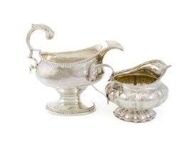 A George III silver sauceboat, by Thomas Evans, London 1775, oval form, beaded border, scroll