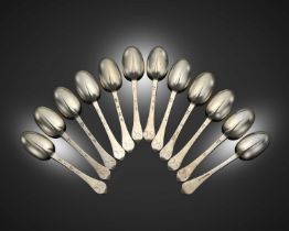 A matched set of twelve William and Mary and George IV silver Dog-nose spoons, eleven by Thomas