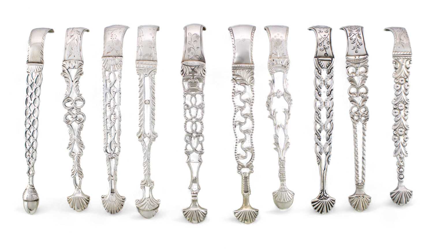 A collection of ten pairs of George III cast silver sugar tongs, various dates and makers, pierced