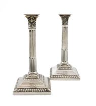A pair of George III silver tapersticks, by Peter Werritzer, London 1767, corinthian column form,