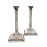 A pair of George III silver tapersticks, by Peter Werritzer, London 1767, corinthian column form,