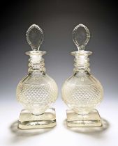 An unusual pair of Irish cut glass decanters and stoppers, 19th/early 20th century, the rounded