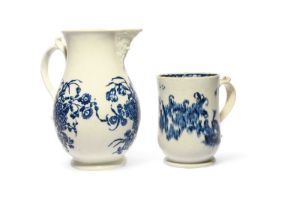 A Caughley blue and white mask jug, c.1770, printed with the Three Flowers pattern, and a