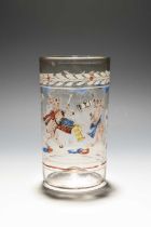 A German enamelled glass beaker (humpen), dated 1715, painted with two cavorting hares, one
