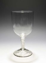 A large toasting or mixing glass, c.1760-70, the deep U-shaped bowl raised on a multiseries opaque