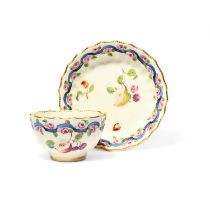 A Chelsea-Derby fluted teabowl and saucer, c.1770-75, well painted with sprigs of fruit including