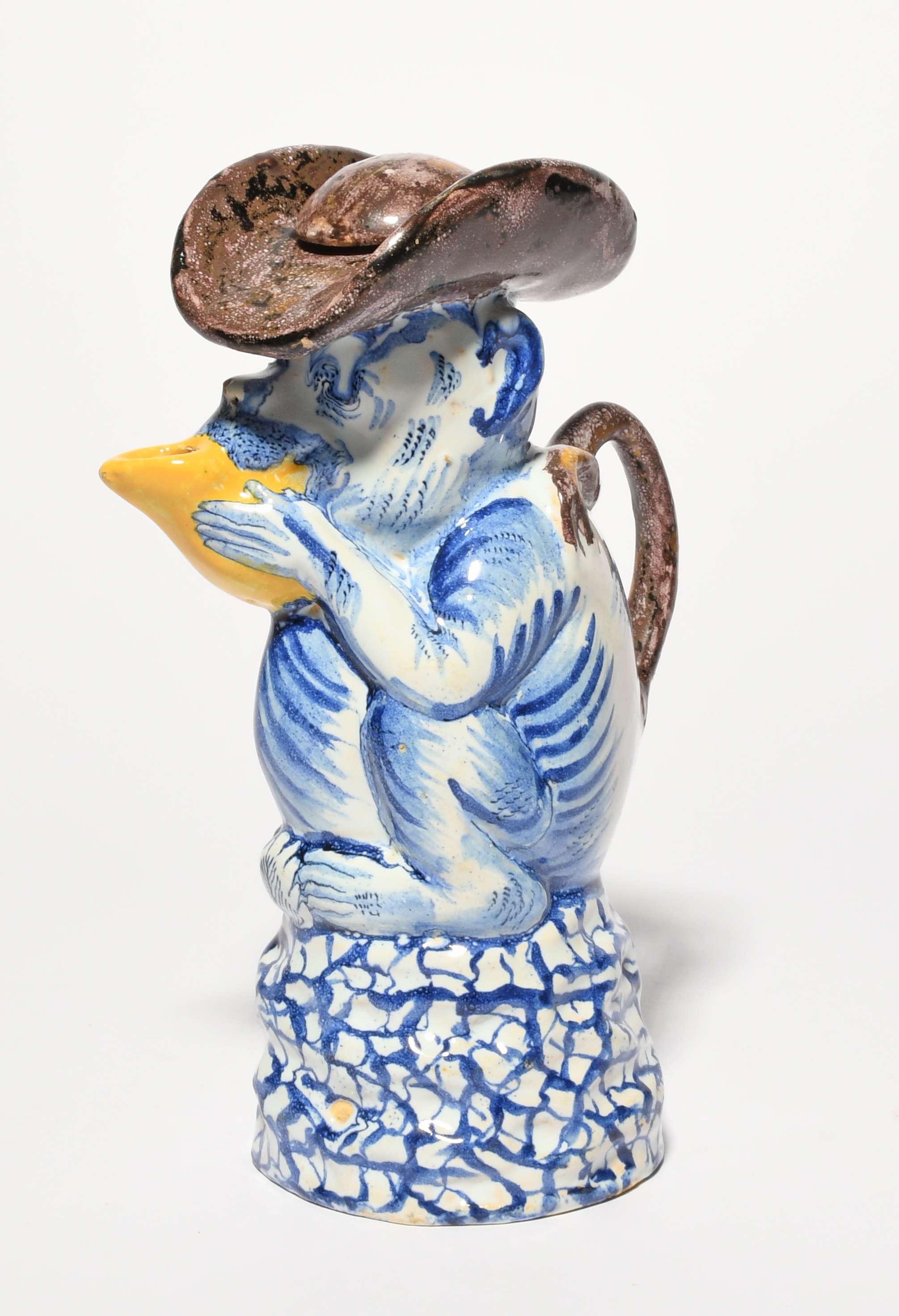 A Delft comical monkey jug and cover, mid 18th century, modelled as a monkey holding a fruit up to - Image 3 of 3