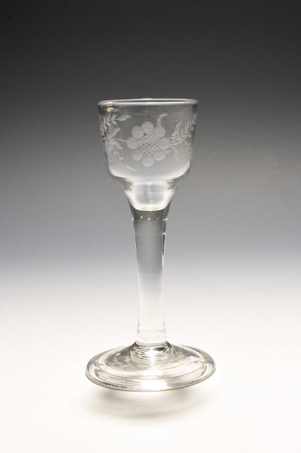 A small wine glass of Jacobite significance, c.1750, the ogee bowl engraved with a sunflower spray