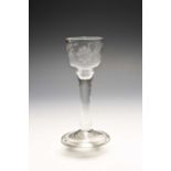 A small wine glass of Jacobite significance, c.1750, the ogee bowl engraved with a sunflower spray