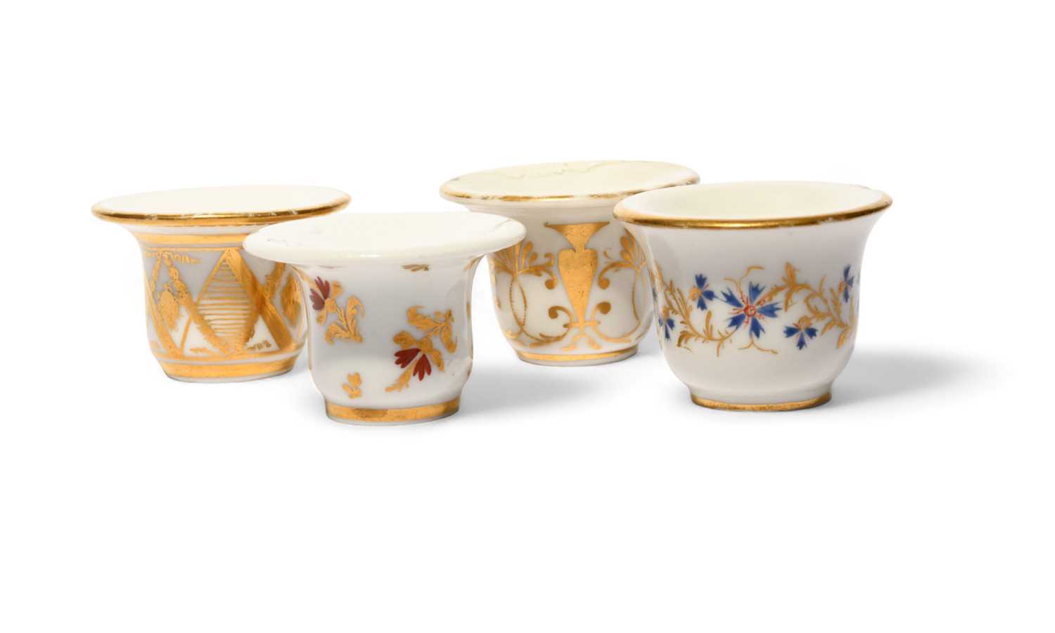 Four Paris porcelain rouge pots, c.1800-20, variously decorated with floral, foliate and geometric